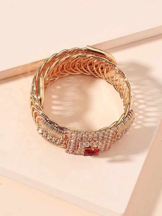True Elegance! Turns Heads Wherever You Go. Beautifully Designed 10K Gold Plated Bracelet over Brass. Multiple Bright White Zircon Diamonds and a Magnificent Simulated Rubi That Makes This Bracelet Make You Feel Like a QUEEN!